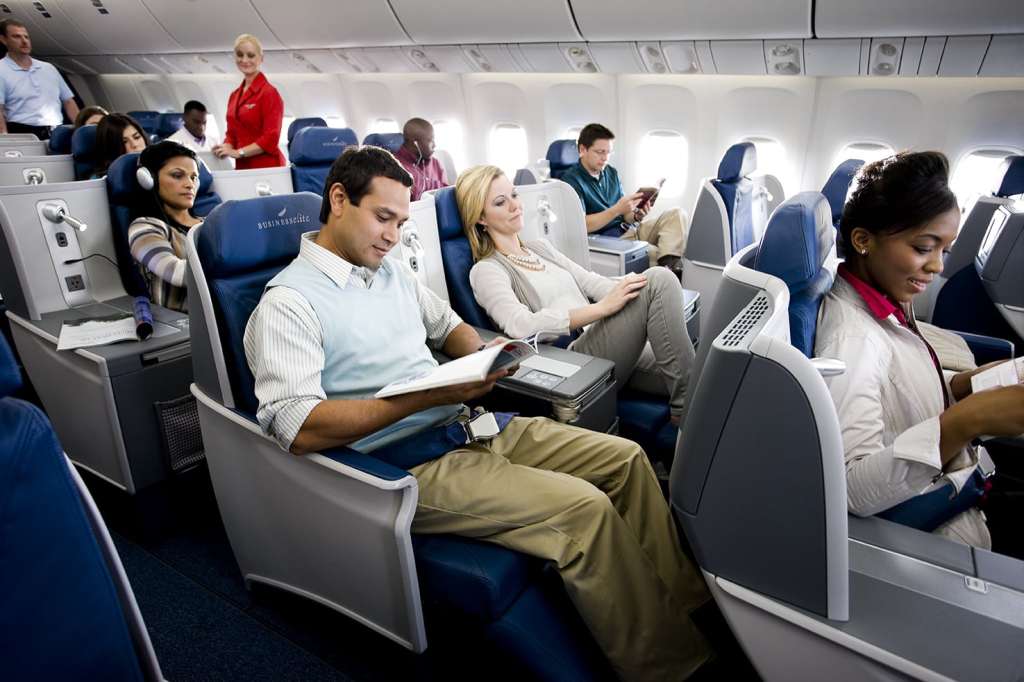 2 people sitting in a plane.