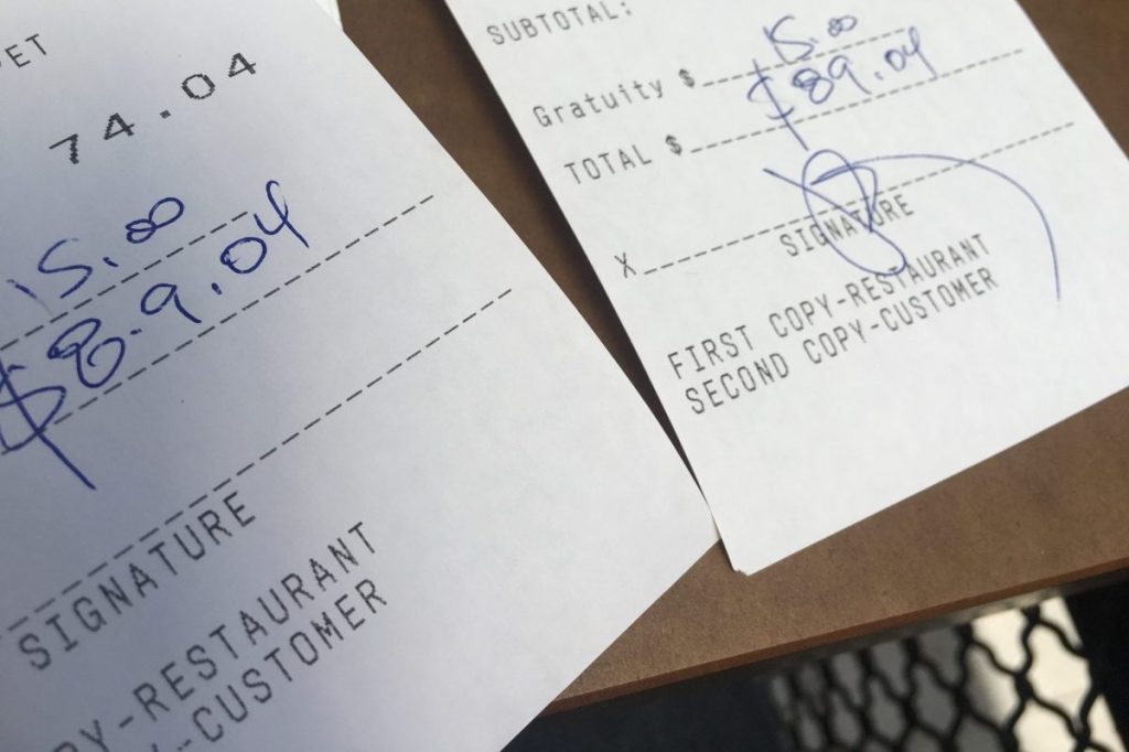 Two restaurant receipts side by side.