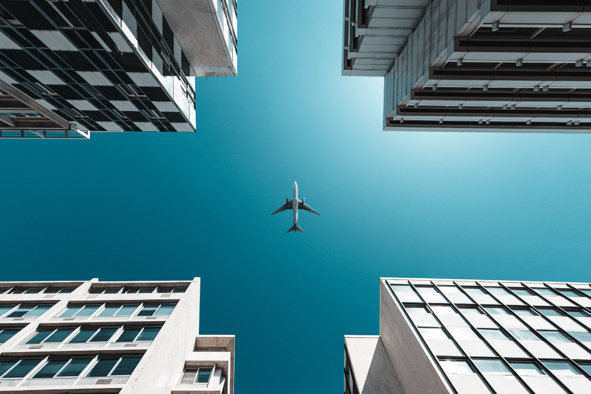airplane flying over city
