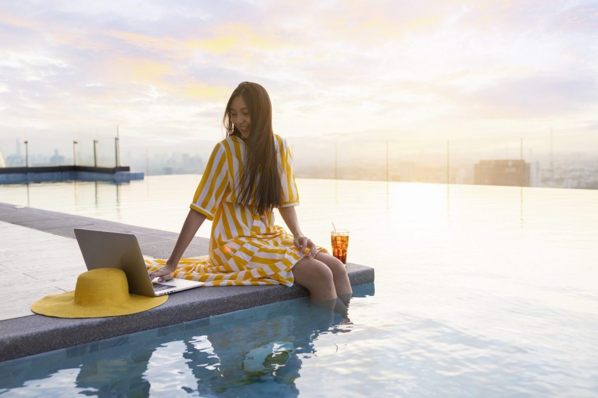 A woman enjoying. blended work and leisure travel trip.