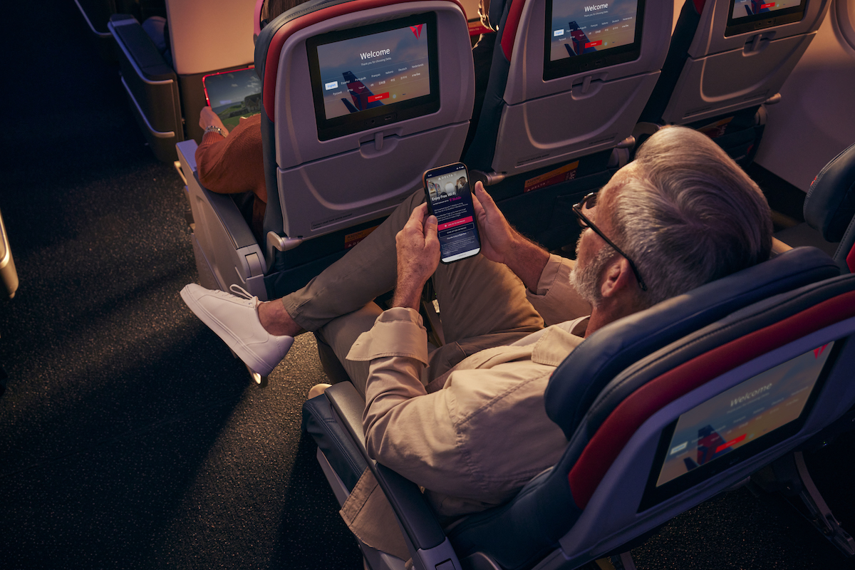 A traveler uses Wi-Fi on their device on a Delta flight