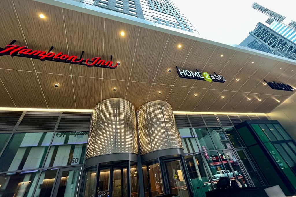 Three hotel brand signs on one building