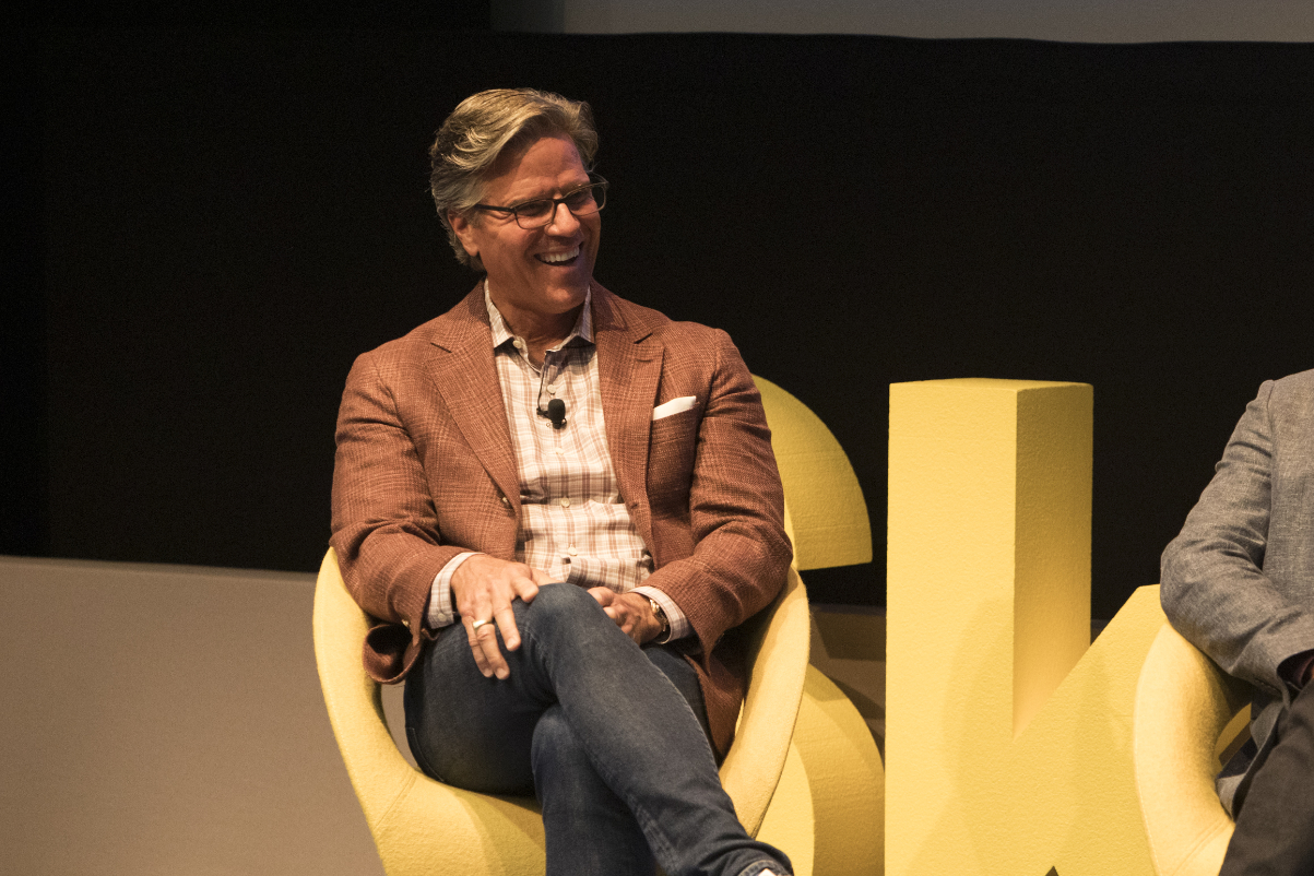chris hemmeter talking on stage about venture capital at a skift event in new york city
