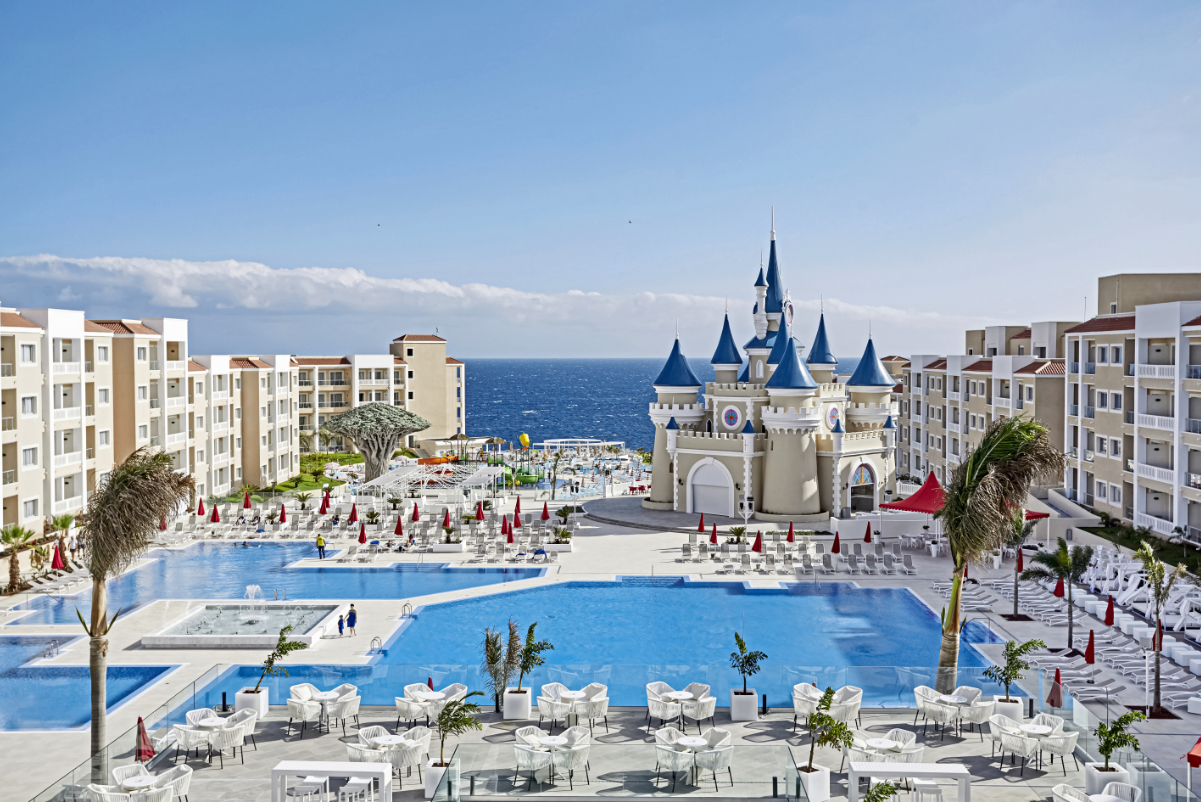 a luxurious resort in Spain with a swimming pool near the sea
