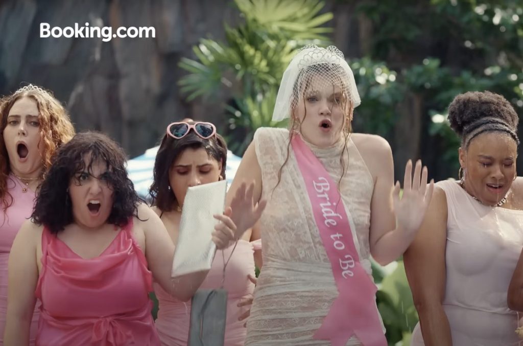 A wedding party that just got drenched at a swimming pool.