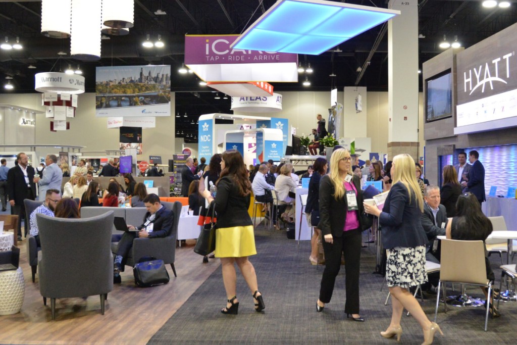 business travelers on the floor of an expo
