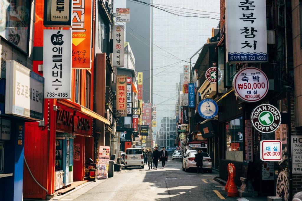 People walking down a side street in Seoul, South Korea