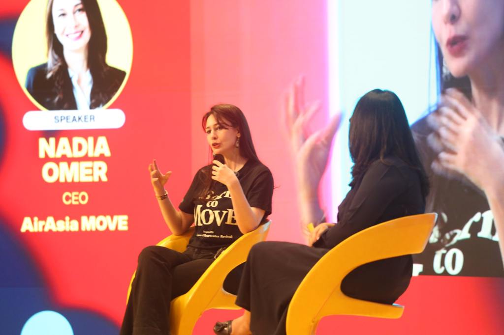 Two women in an interview session on a stage