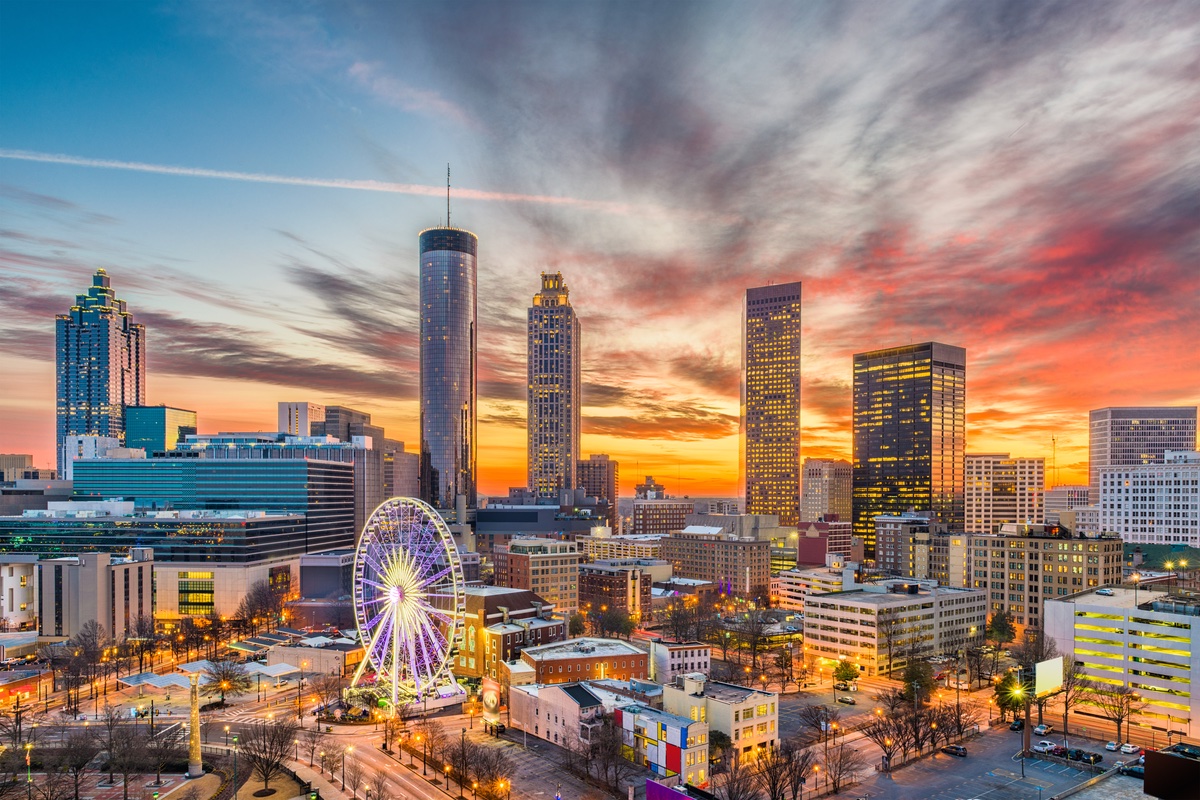 view of a city skyline with a sunset behind it.