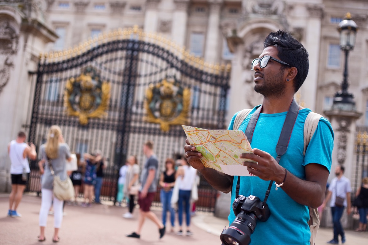 A tourist a map and his camera.