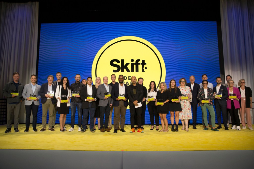 IDEA Awards winners on stage with Skift founder at Skift Global Forum
