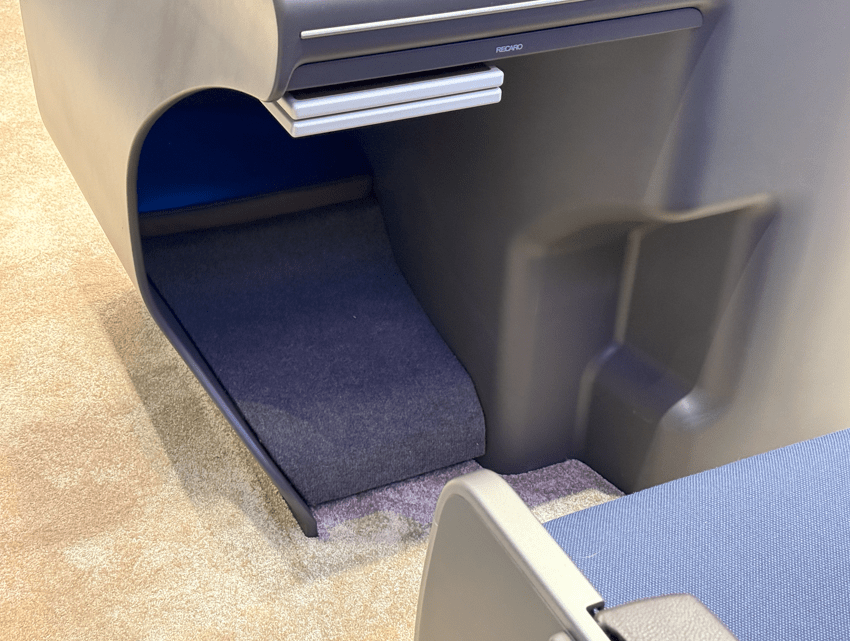 A Recaro seat on display at the 2025 Aircraft Interiors Expo.