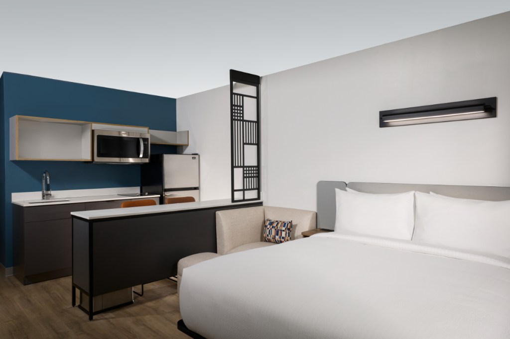 a guest room at a new but plain hotel