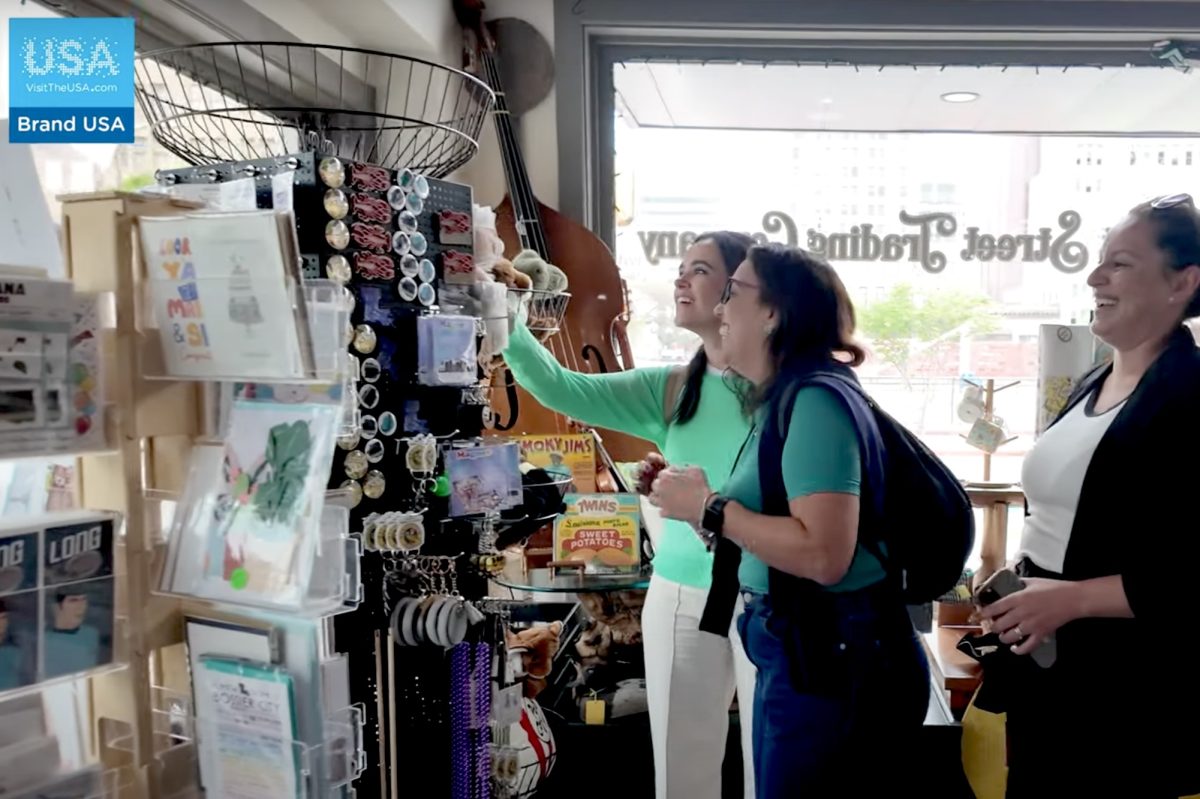 People looking at souvenirs in a shop.