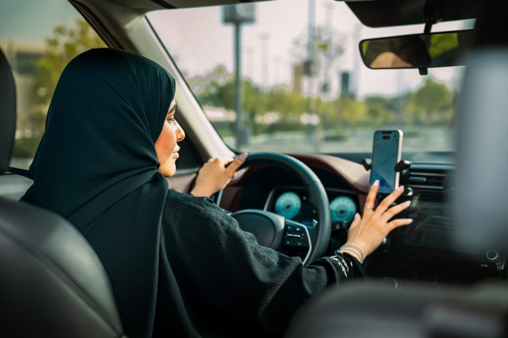 A local Saudi woman driving a taxi