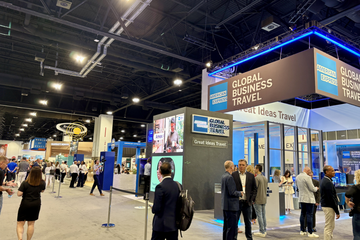 people in the corporate travel industry walking around a trade room show floor