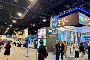 people in the corporate travel industry walking around a trade room show floor