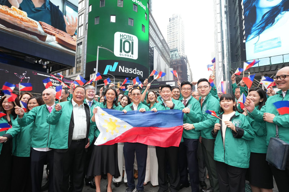 image of filipinos celebrating the debut of Hotel101 as a public company with a gathering in new york city's times square