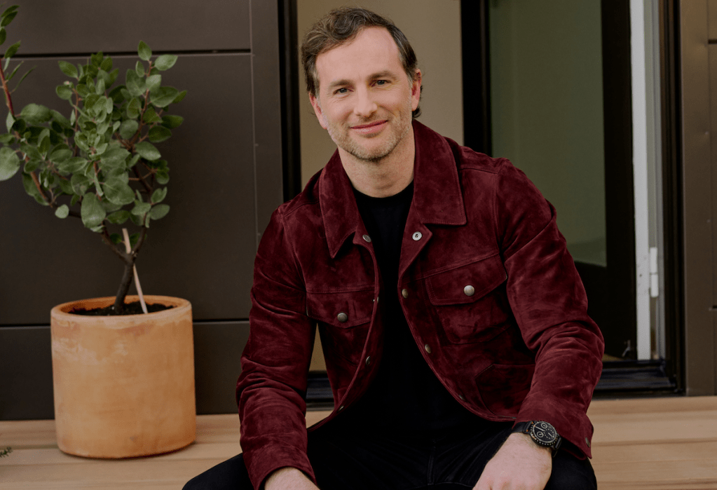 Airbnb co-founder Joe Gebbia sitting.
