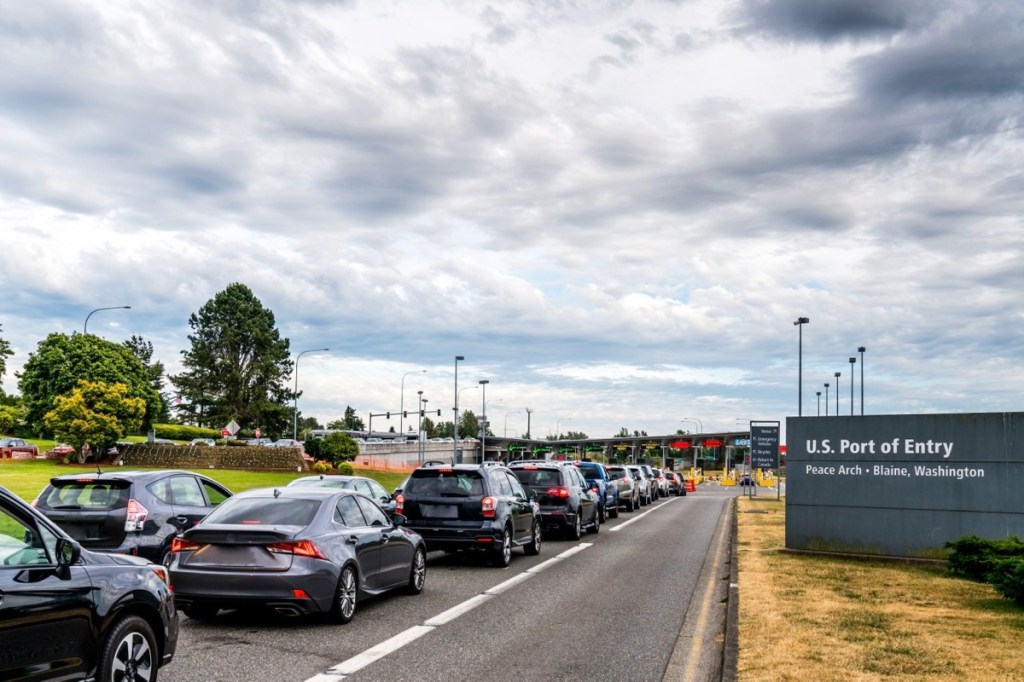 Cars lined up at a border crossing
