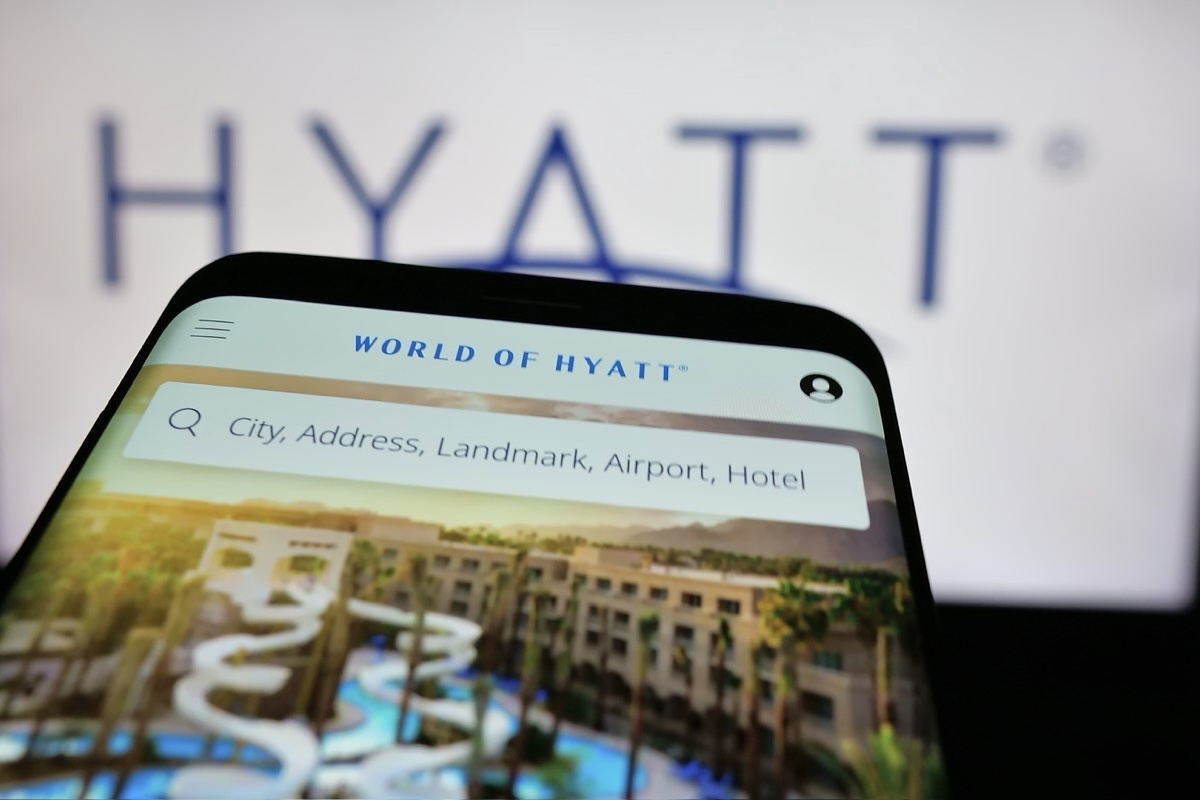 View of a smartphone and a computer screen with Hyatt branding