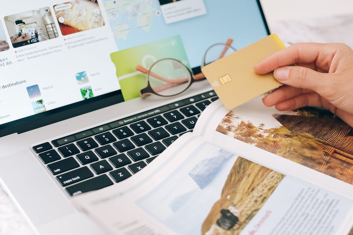 Representational image: Person Holding Credit Card and Searching on the Internet.