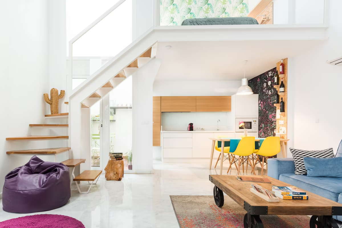 Image of a loft apartment in Seville, Spain, that looks like it is out of a Pedro Moldavar artistic movie, with lots of color and modern design.