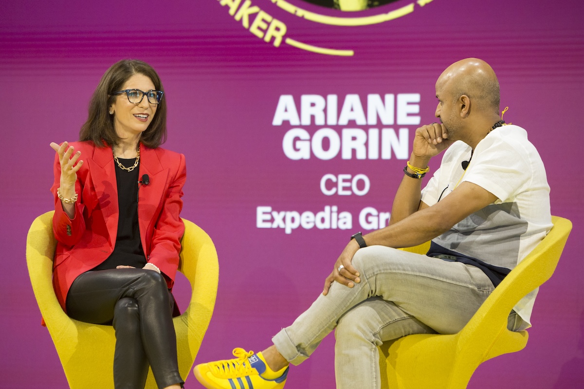 A woman and a man in an on-stage interview at Skift Global Forum 2025.