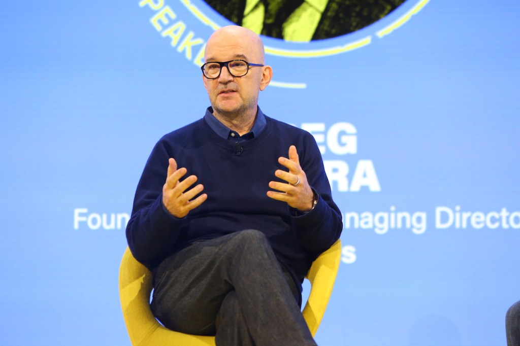 greg o'hara speaking on stage at skift global forum 2025