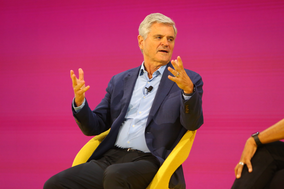 steve case speaking onstage at skift global forum 2025