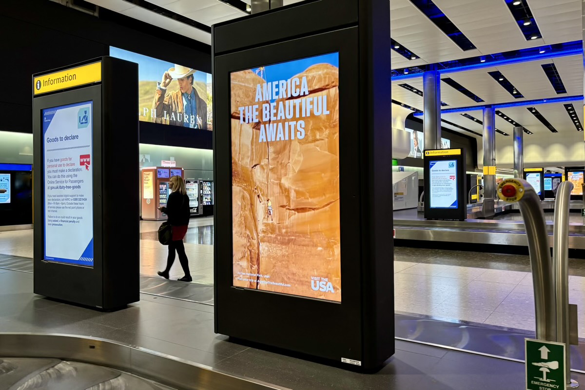 An advertisement on a luggage carousel.