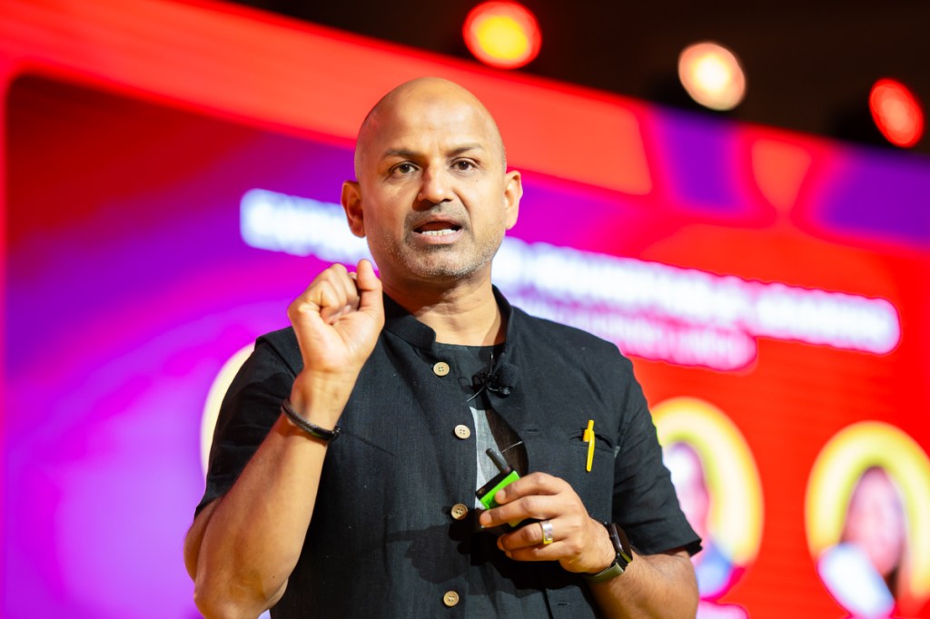 a man speaking on stage