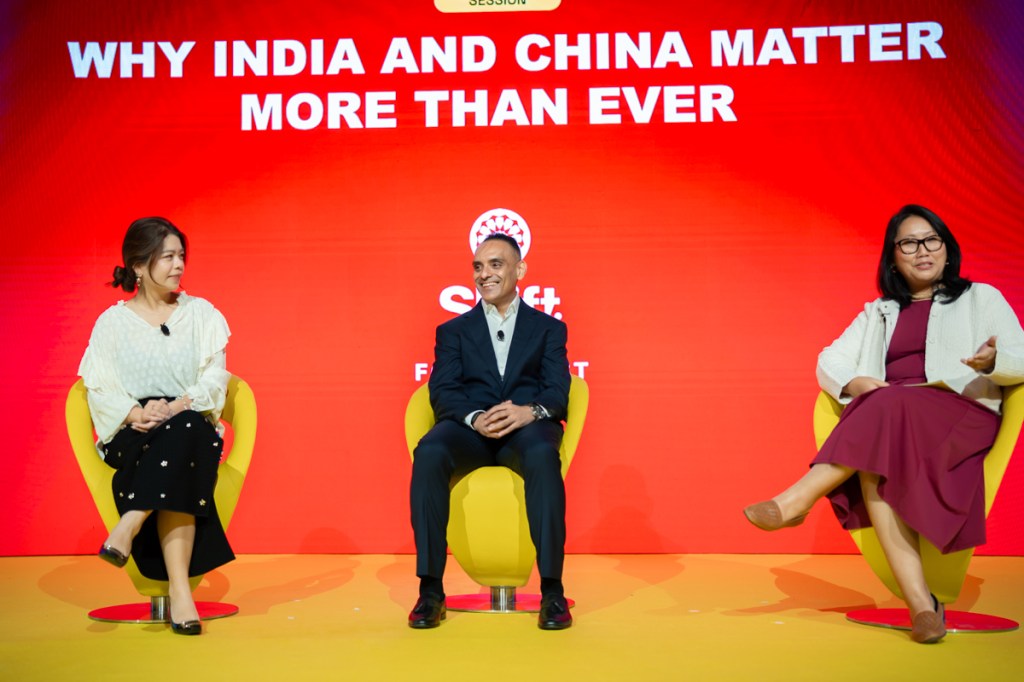 Three people in conversation on stage.