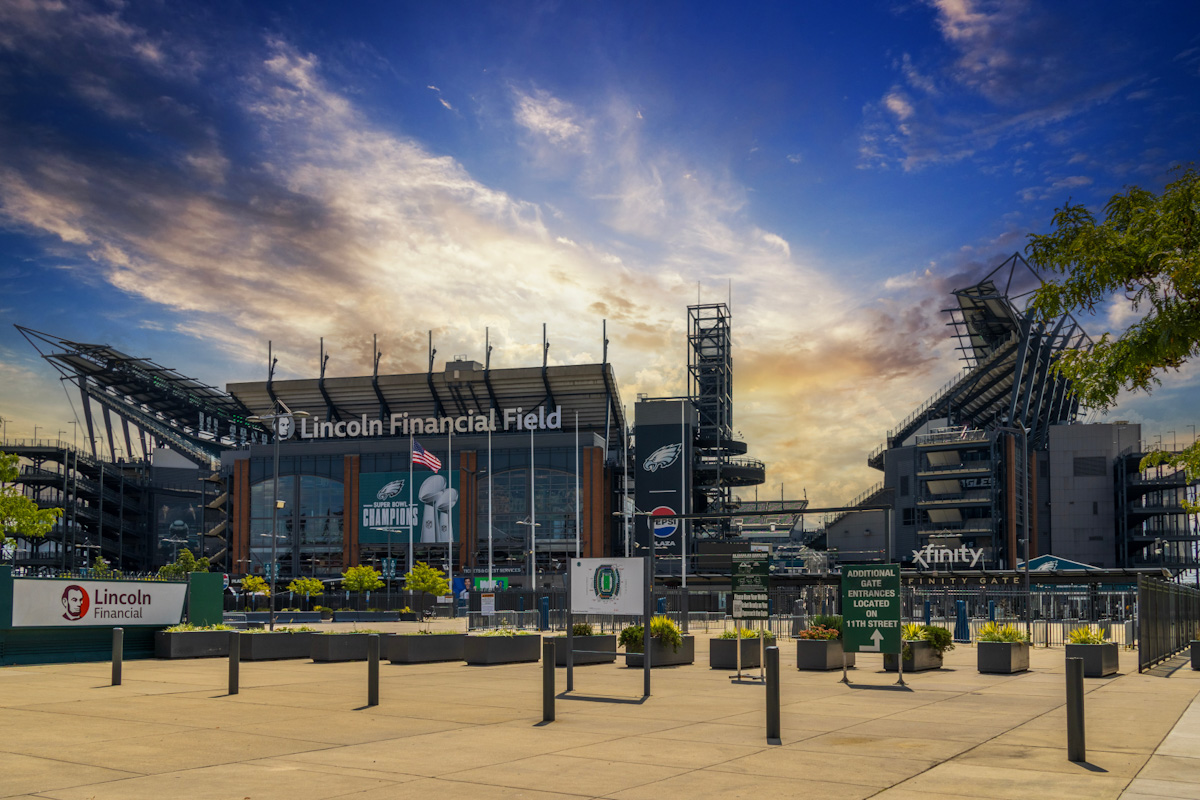 Exterior view of stadium grandstands under a blue sky