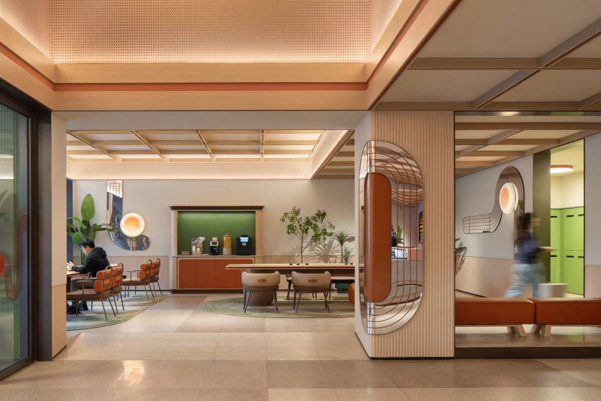 the lobby of a modern hotel in Shanghai under the Orange brand of hotel group H World