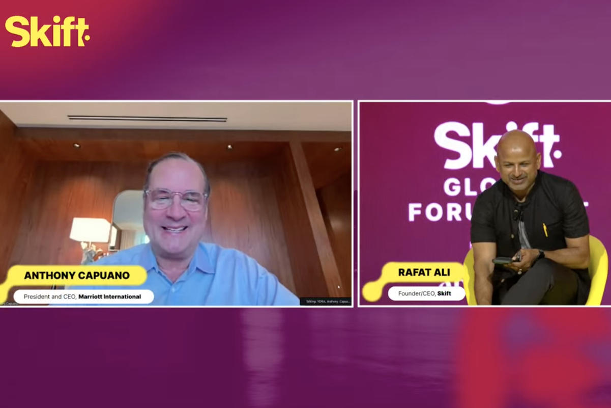 a screenshot of the CEO of Marriott International Anthony Capuano talking remotely with the CEO of Skift at a conference in Abu Dhabi