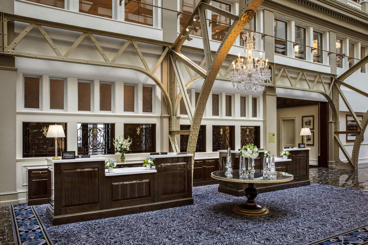 Image of a front desk inside a luxury hotel called the Waller of Astoria in Washington DC
