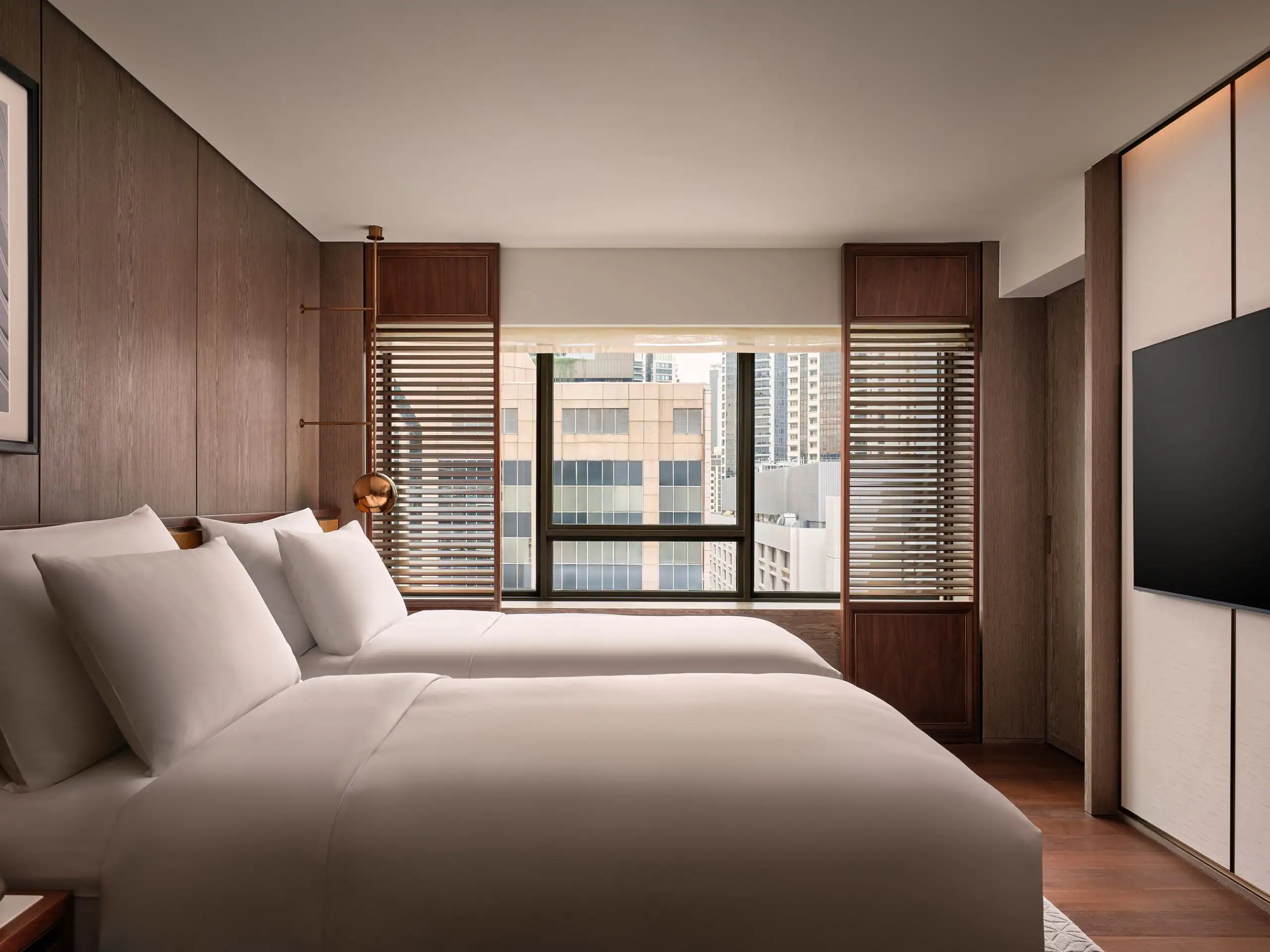 View of a luxury hotel room in Singapore under the Grand Hyatt brand.