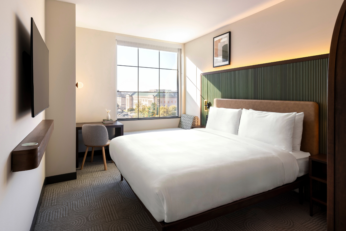 View of a brightly lit hotel guest room in Washington DC.