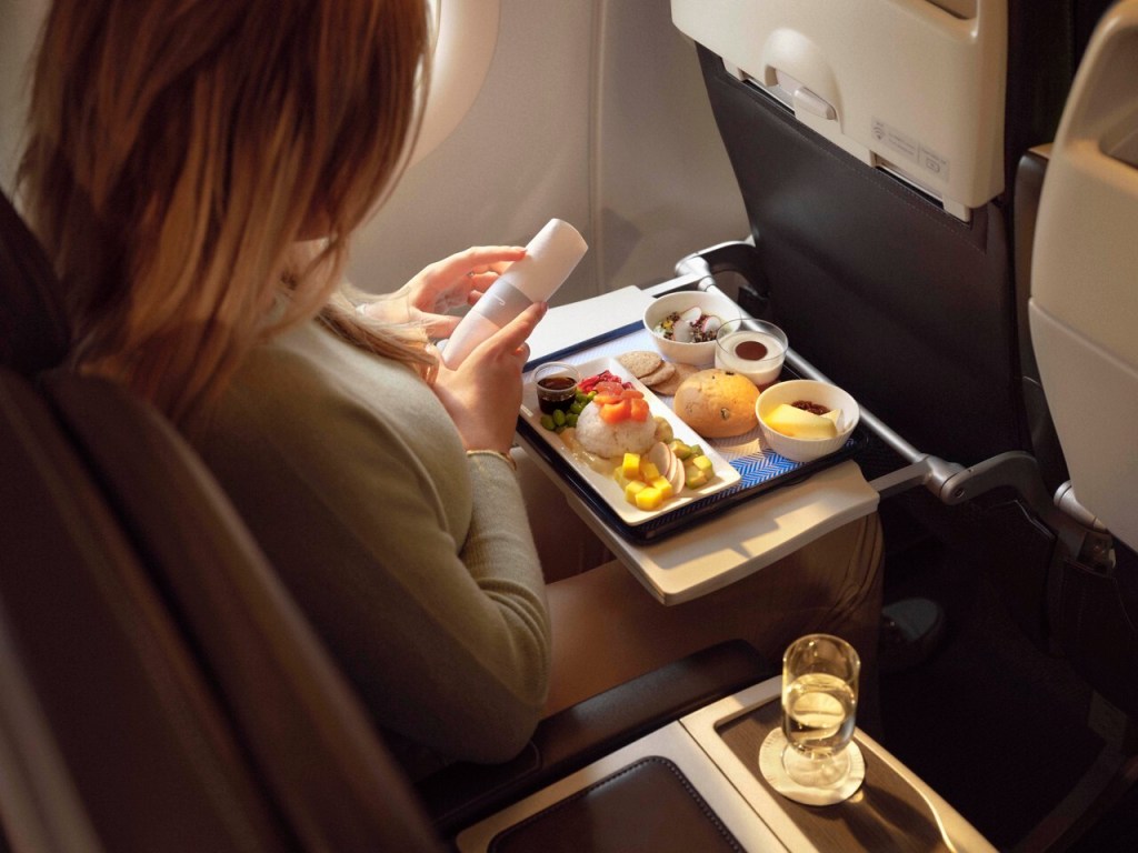 A British Airways Club Europe passenger with a meal.
