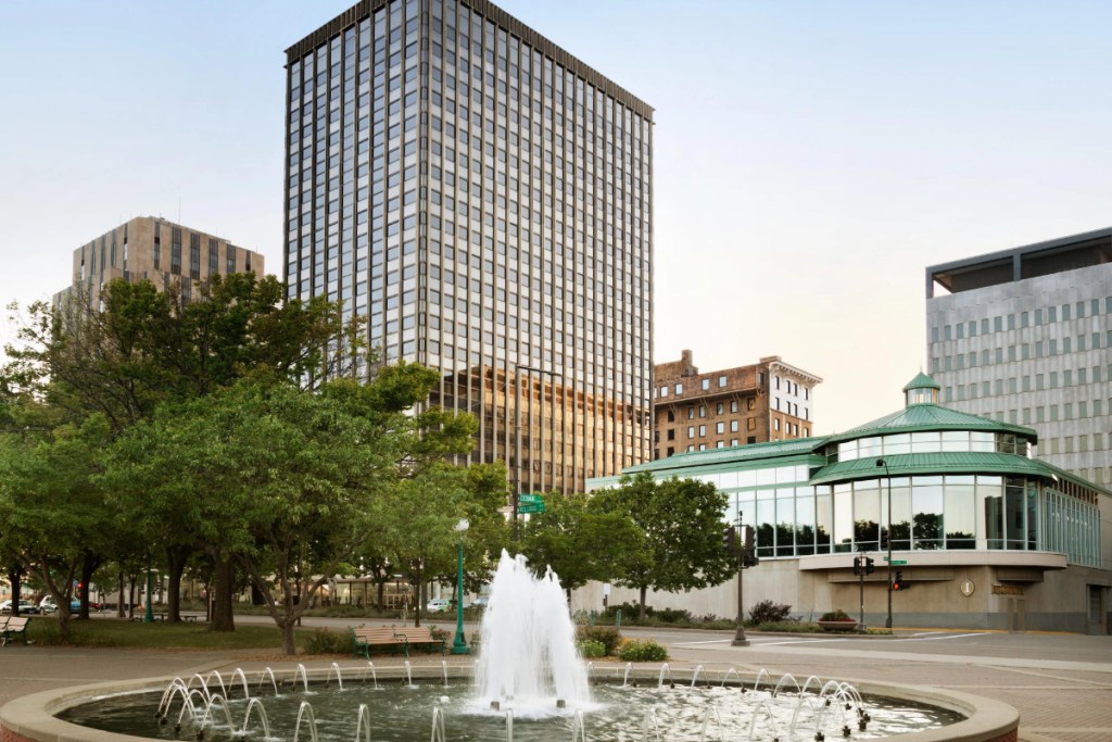 exterior of a hotel on a sunny day with a fountain in front, at the downtown InterContinental Saint Paul Riverfront hotel in Minnesota