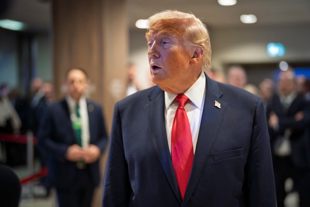 An image of President Trump talking to reporters at Davos in January 2026