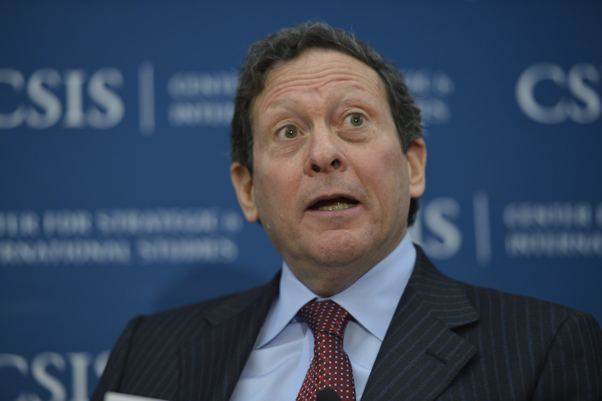 image of a man in a suit talking
