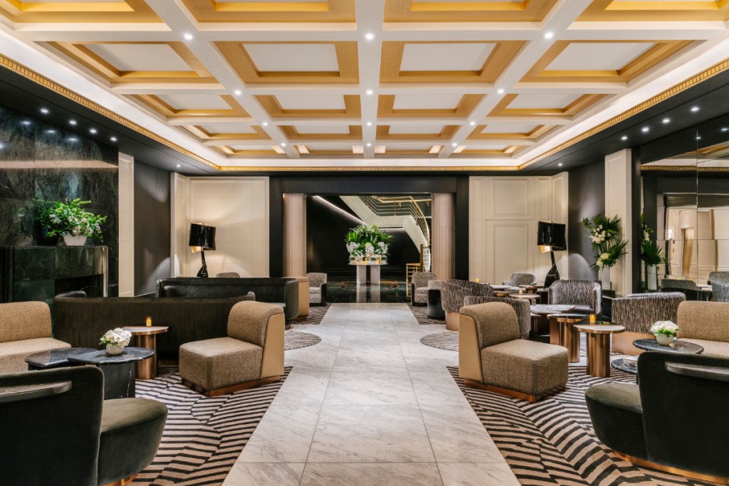 view inside the brightly lit lobby of a luxury hotel, the newly renovated Sofitel New York