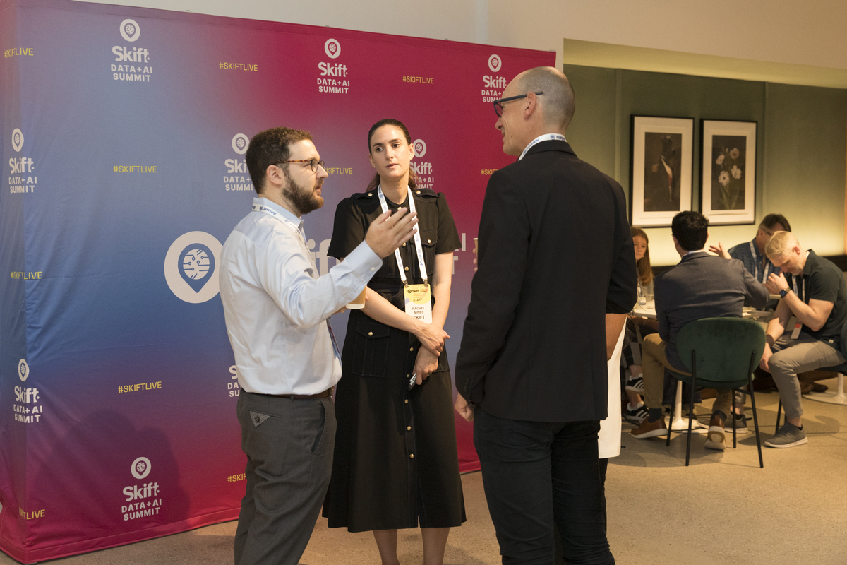 attendees having a conversation at Skift Data+AI Summit 2025