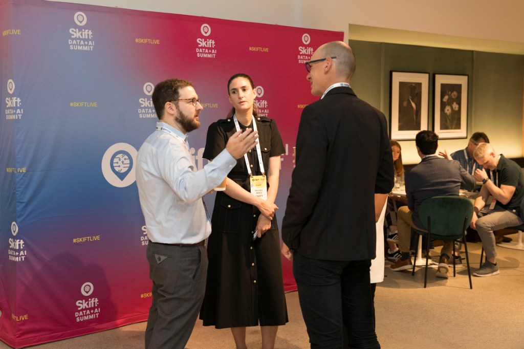 attendees having a conversation at Skift Data+AI Summit 2025