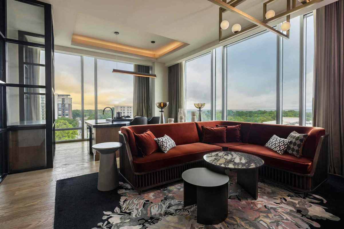 Image of a guest room at a recently refurbished upscale hotel called the Tess Atlanta, which is part of Marriott's Autograph Collection and is managed by Peregrine Hospitality.